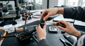 A high-angle, professional editorial close-up of a technician's hands carefully installing a sleek d